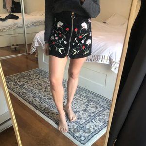 Black skirt with floral closure